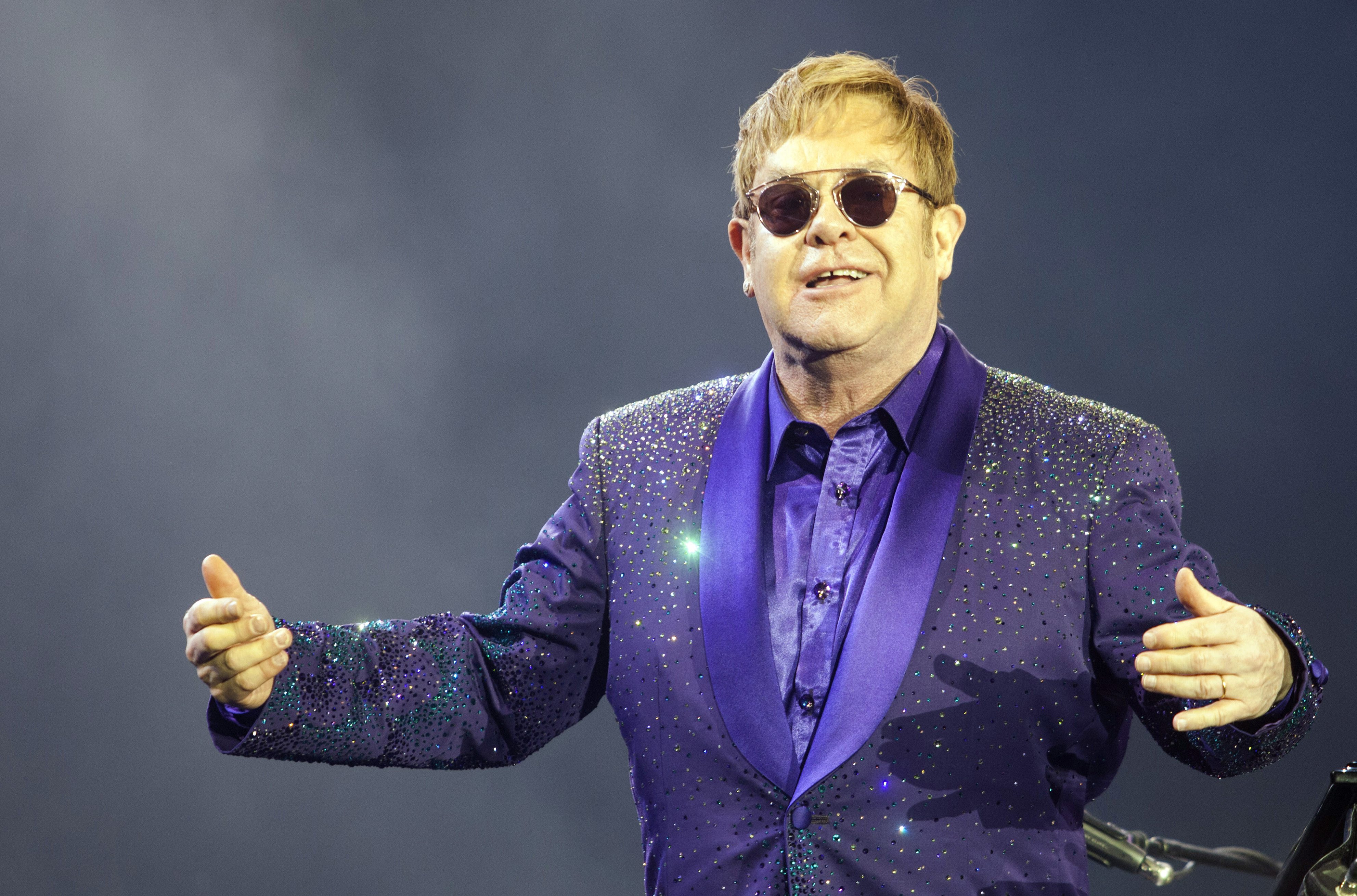 FILE- In this Thursday, May 26, 2016 file photo, musician Elton John performs during a show in Tel Aviv. Elton John is chronicling his "crazy life" in an autobiography to be published in 2019, he said in a statement on Thursday, Oct. 13, 2016. (AP Photo/Dan Balilty, File)